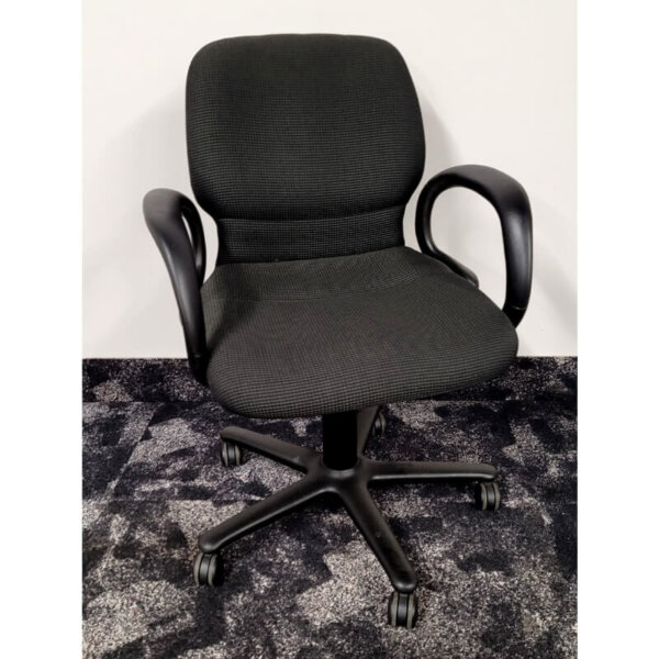 Steelcase Sensor meeting room chair with loop arms, black frame with black/grey patterned seats