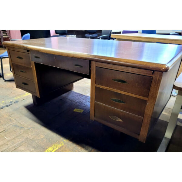 Quality-built pre-owned teachers desk 66"w x 36"d  Dove-tail joints lots of storage three pull-out writing trays centre pencil drawer