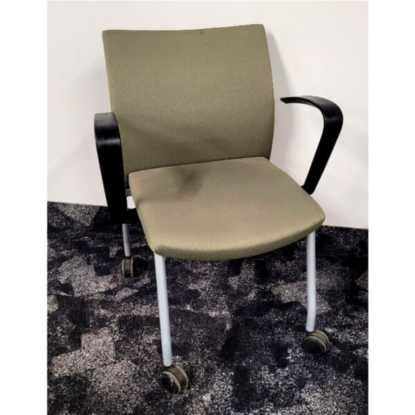 Krug Dorso chair on wheels fixed black loop arms silver legs moss green fabric