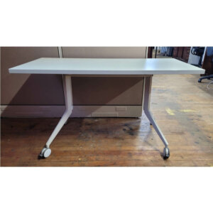 Haworth Rectangular Mobile Table Dimensions: 54"w x 24.5"d x 29"h Off white surface with white legs Locking castors