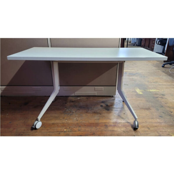 Haworth Rectangular Mobile Table Dimensions: 54"w x 24.5"d x 29"h Off white surface with white legs Locking castors