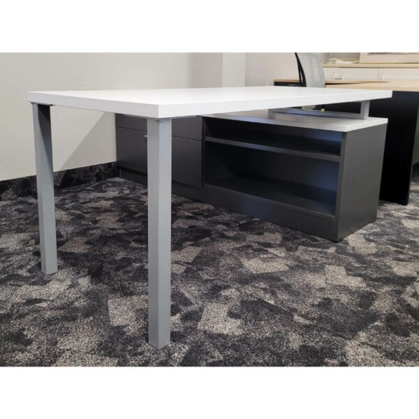 IOF "L" Shape Benching Suite Overall Size: 66"w x 72"d x 29"h Pictured in White & Charcoal Laminate / Silver Straight Pulls Custom credenza with a wide box drawer and locking lateral file drawer and bookcase Thick 1.5" laminate work surface