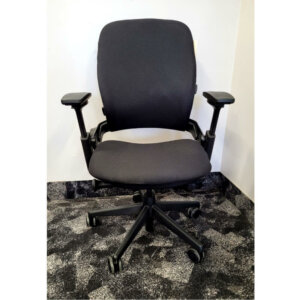 Steelcase Leap V2, Black frame; reupholstered in black fabric, Upper back force, 5" pneumatic seat-height adjustment, Variable backstop, Lower back firmness, Rectilinear independent height-, width-, pivot-, and depth- adjustable arms and soft arm caps, 3" seat depth adjustment, Passive seat edge angle, Adjustable lumbar, 2 1⁄2"-diameter, hard-composition, dual-wheel casters
