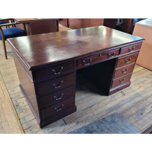 Traditional Double Pedestal Desk Dimensions: 60"w x 32"d x 30"h One file drawer Center pencil drawer and five box drawers