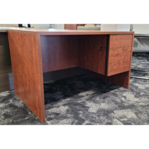 Natalex 30" x 48" Desk; Cherry Overall: 30" d x 48"w x 29"h One box/file pedestal 1" thick laminate Recessed modesty panel Fully locking Made in Cambridge