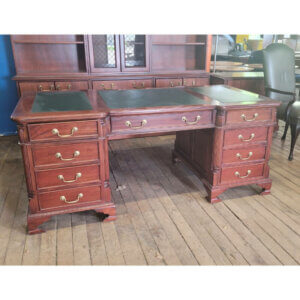 Traditional Double-Sided Desk Overall Dimensions: 71.5"w x 35"d x 30"h Beautiful traditional detailed moldings & edging 9 box drawers & two storage cabinets Green leather in-lay (we can reupholster) Can be disassembled into 3 pieces for easy moving