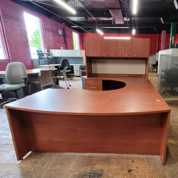 U-Shape Desk Suite with Hutch Overall Dimensions: 72"w (front) x 94"d x 62"w (credenza) x 68"h  Left-hand facing U-shape desk with one box/box/file pedestal Overhead hutch with doors, 21" clearance Tackboard Under hutch task light