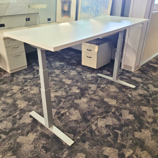 Haworth Used Electric Height Adjustable Table 28" x 70" Electric with 3-Stage Leg Base Finish: Silver Height range: 25.5” - 51.1” Simple height control Original Haworth 1" thick laminate; White